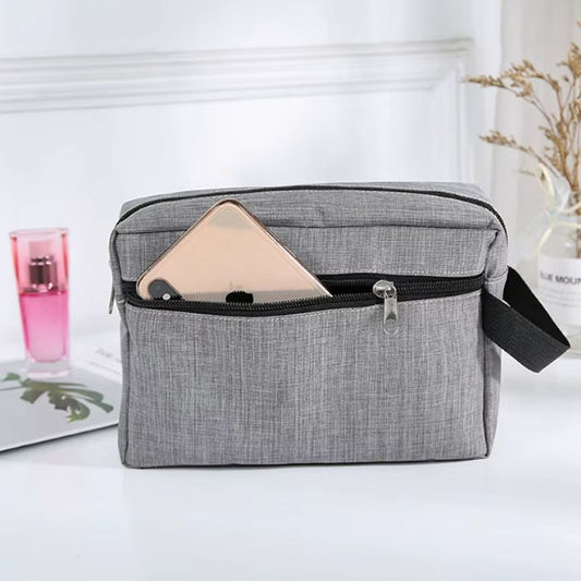 Trousse-de-toilette-legere-et-compacte-grise-avec-smartphone