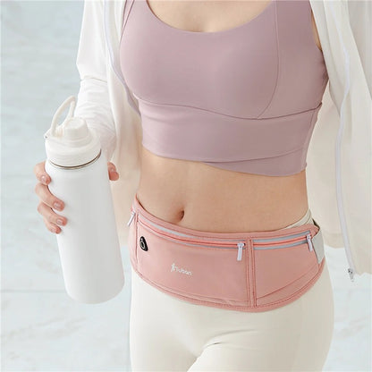banane voyage invisible imperméable ultra plate rose autour de la taille d'une femme
