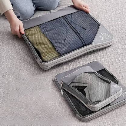cube de compression voyage gris avec des vetements