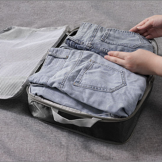 pantalons dans cube de compression voyage