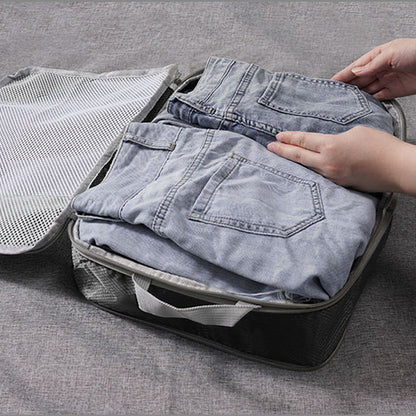 pantalons dans cube de compression voyage
