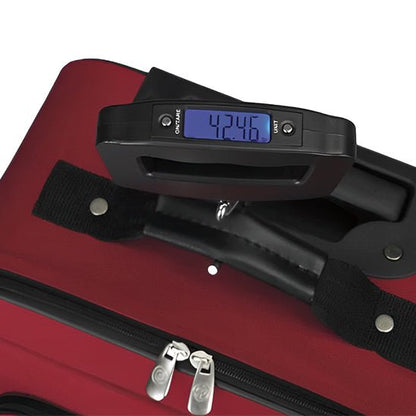 pese valise portable 50kg sur bagage rouge