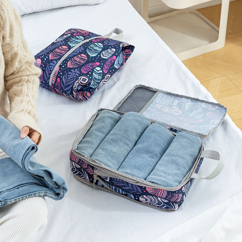 jeans dans sac de rangement valise à compression